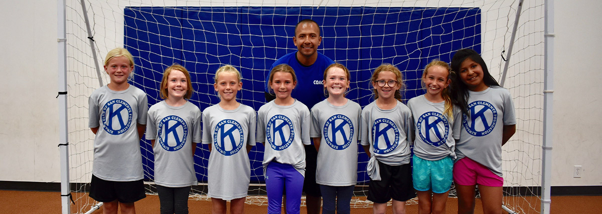 Volunteer Coach with his indoor soccer team